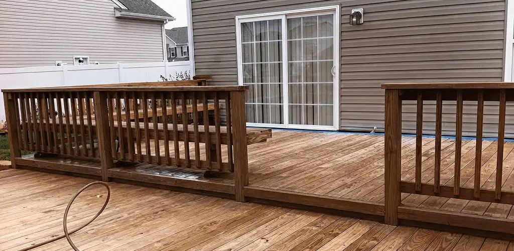 Deck sealing service protecting a backyard wood deck and railings in Phoenix, AZ