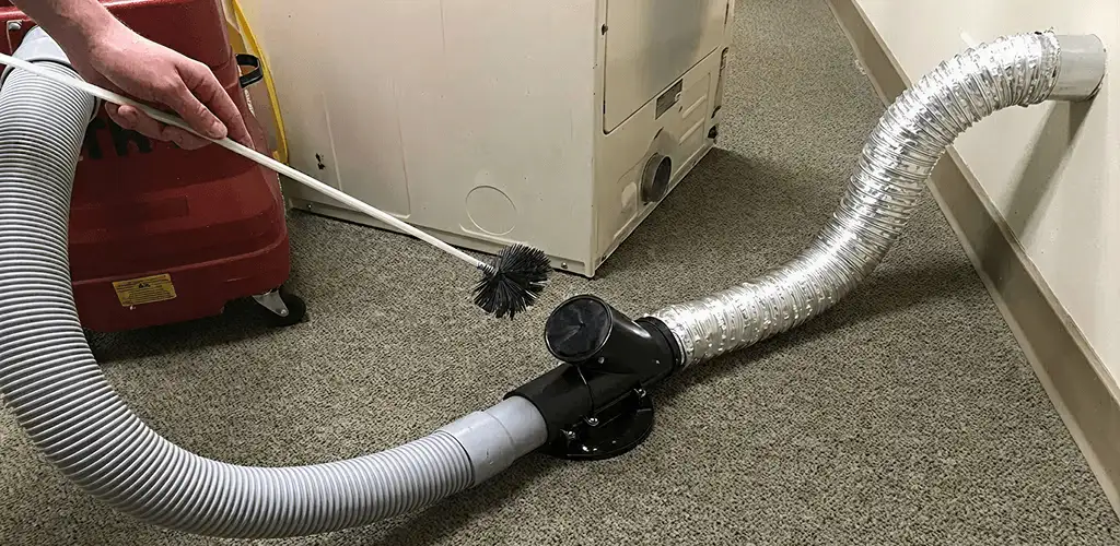 Dryer vent cleaning service removing lint from a dryer duct connection in Phoenix, AZ