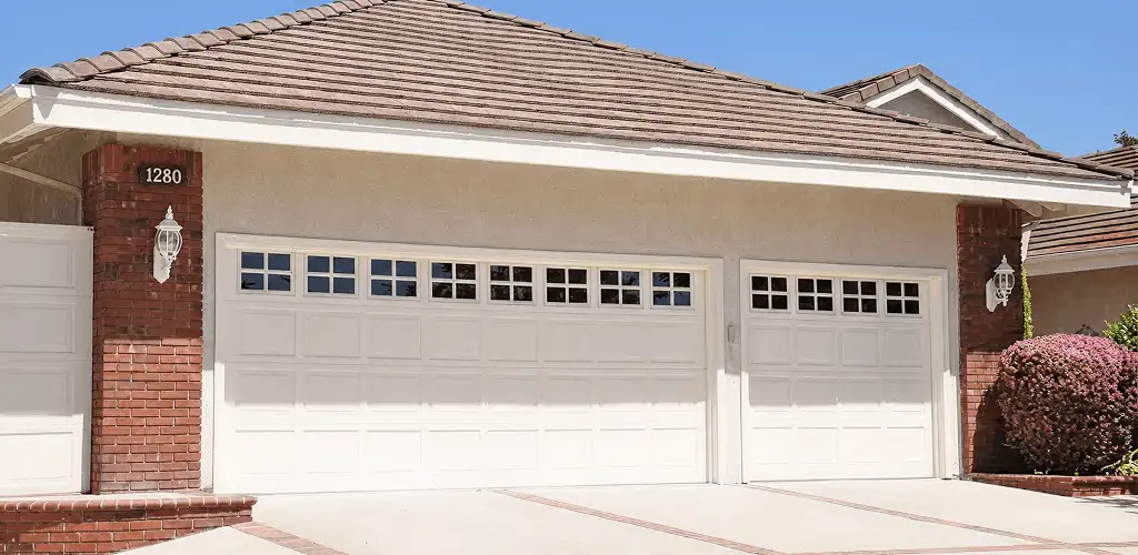 Residential garage door repair service for a double garage door in Phoenix, AZ